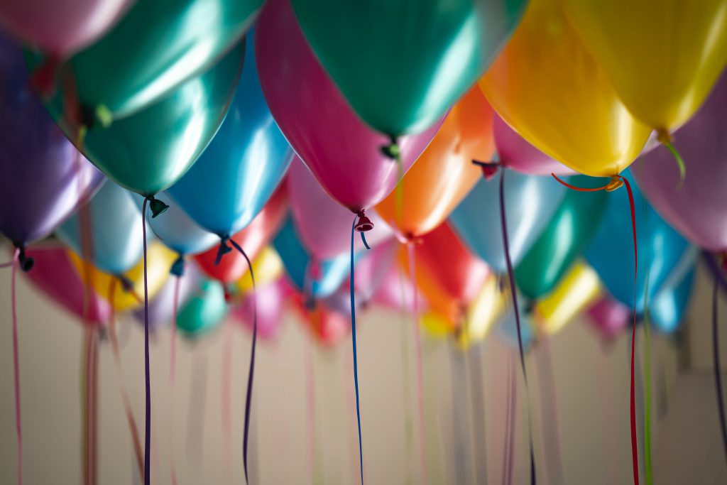 Colorful balloons at a small outdoor event