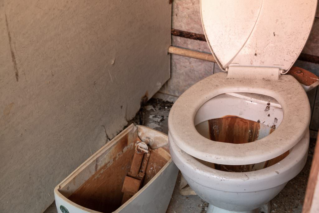Destroyed toilet for a bathroom remodel