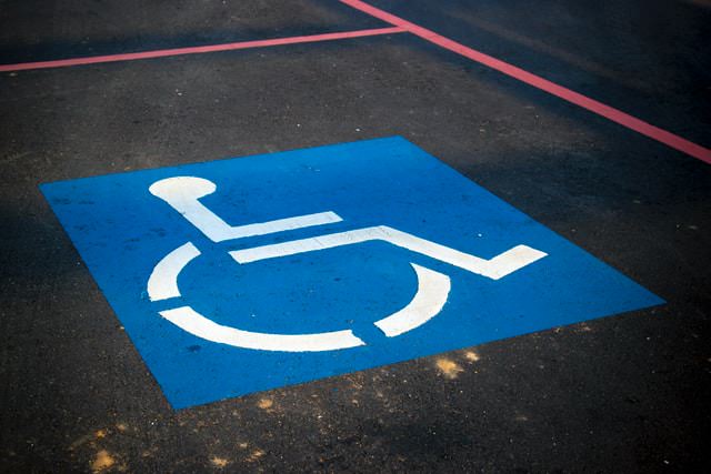 image of wheelchair accessible parking symbol | porta potty rental 