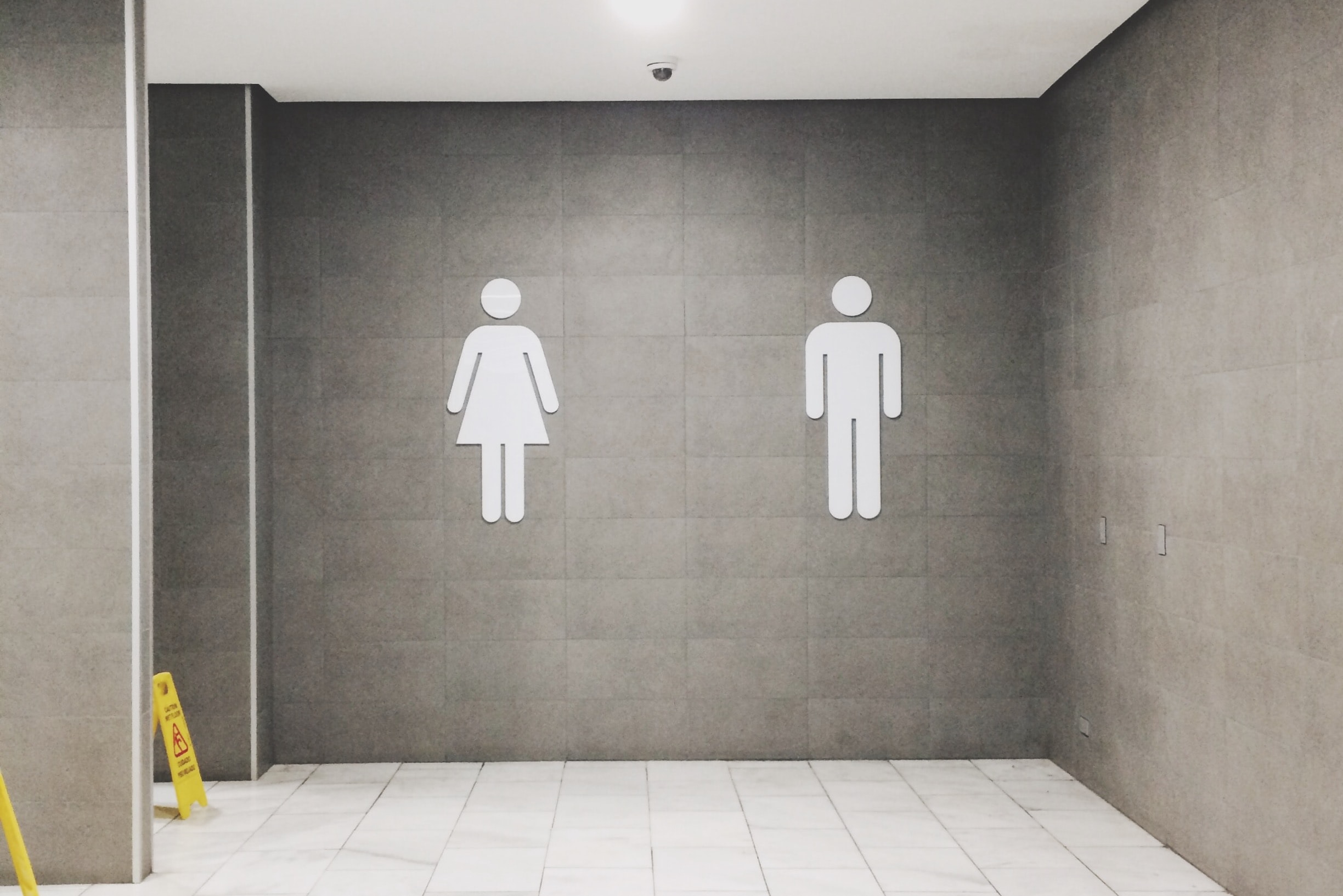 image of a restroom sign with male and female drawings | portable toilet rental washington oregon