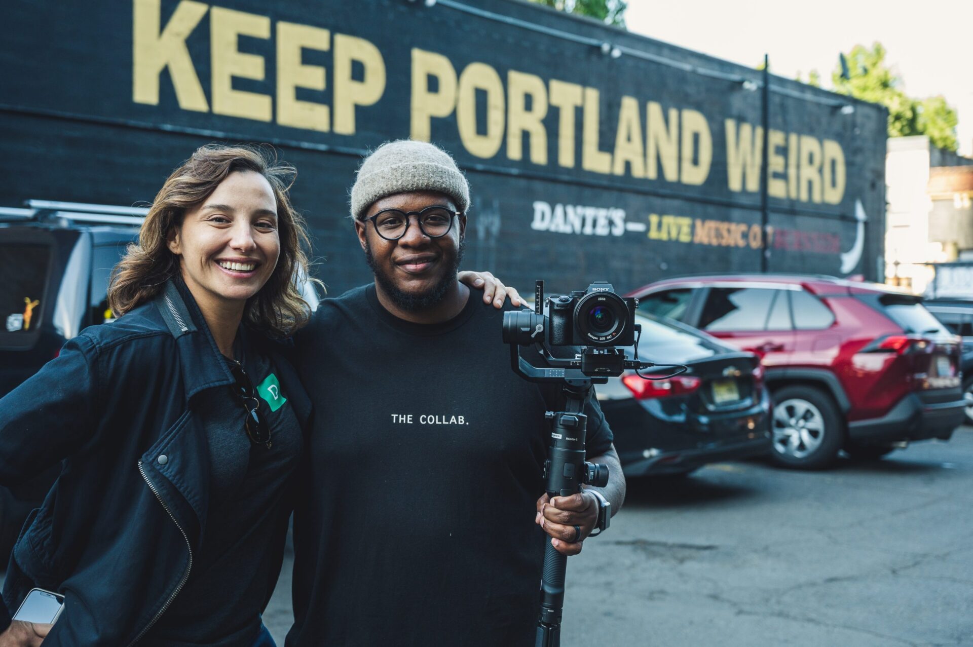 two people standing in front of a bus that says keep portland weird | vancouver porta potty rentals