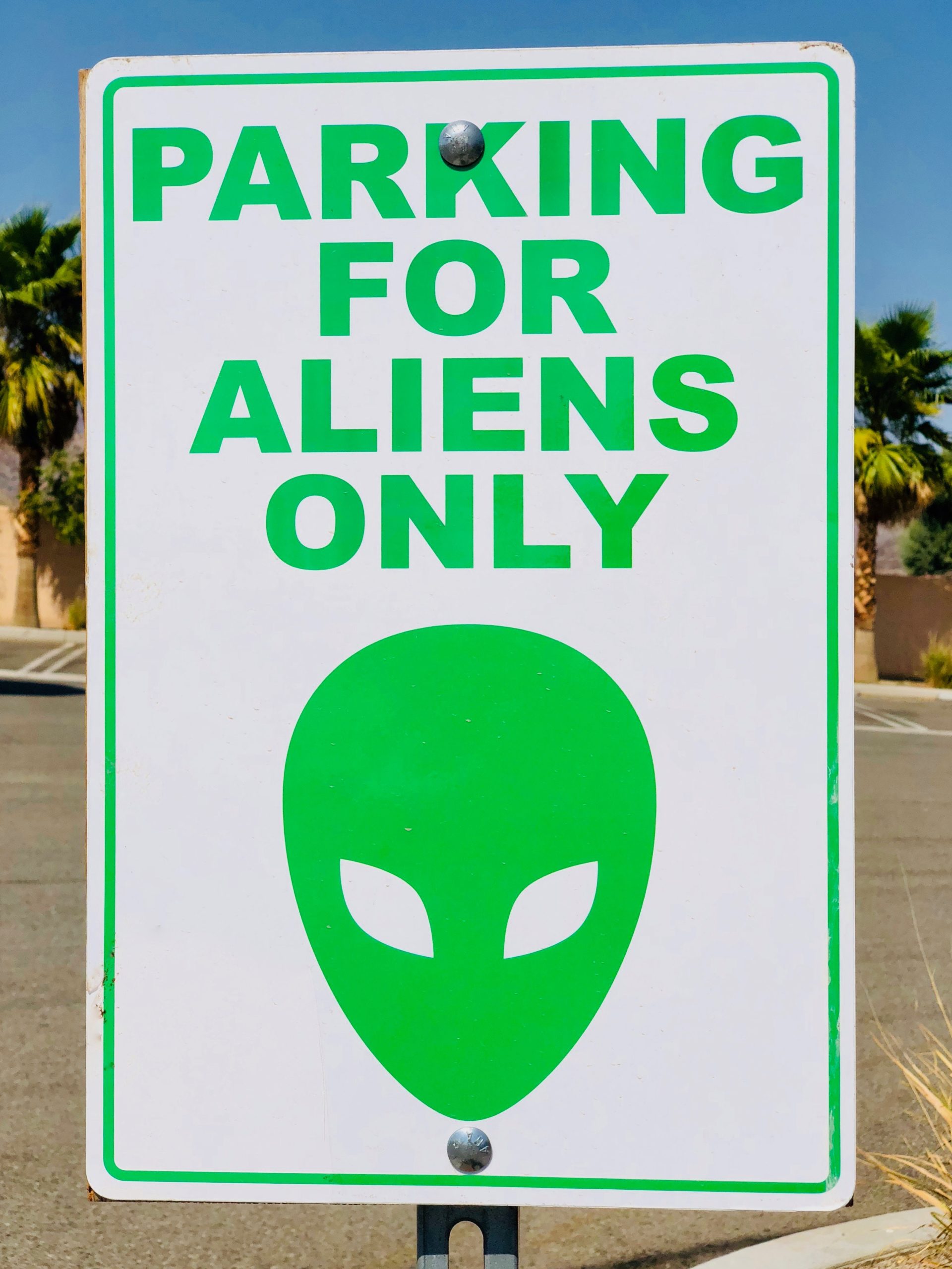 sign that says parking for aliens only | porta potty rentals vancouver salem portland oregon
