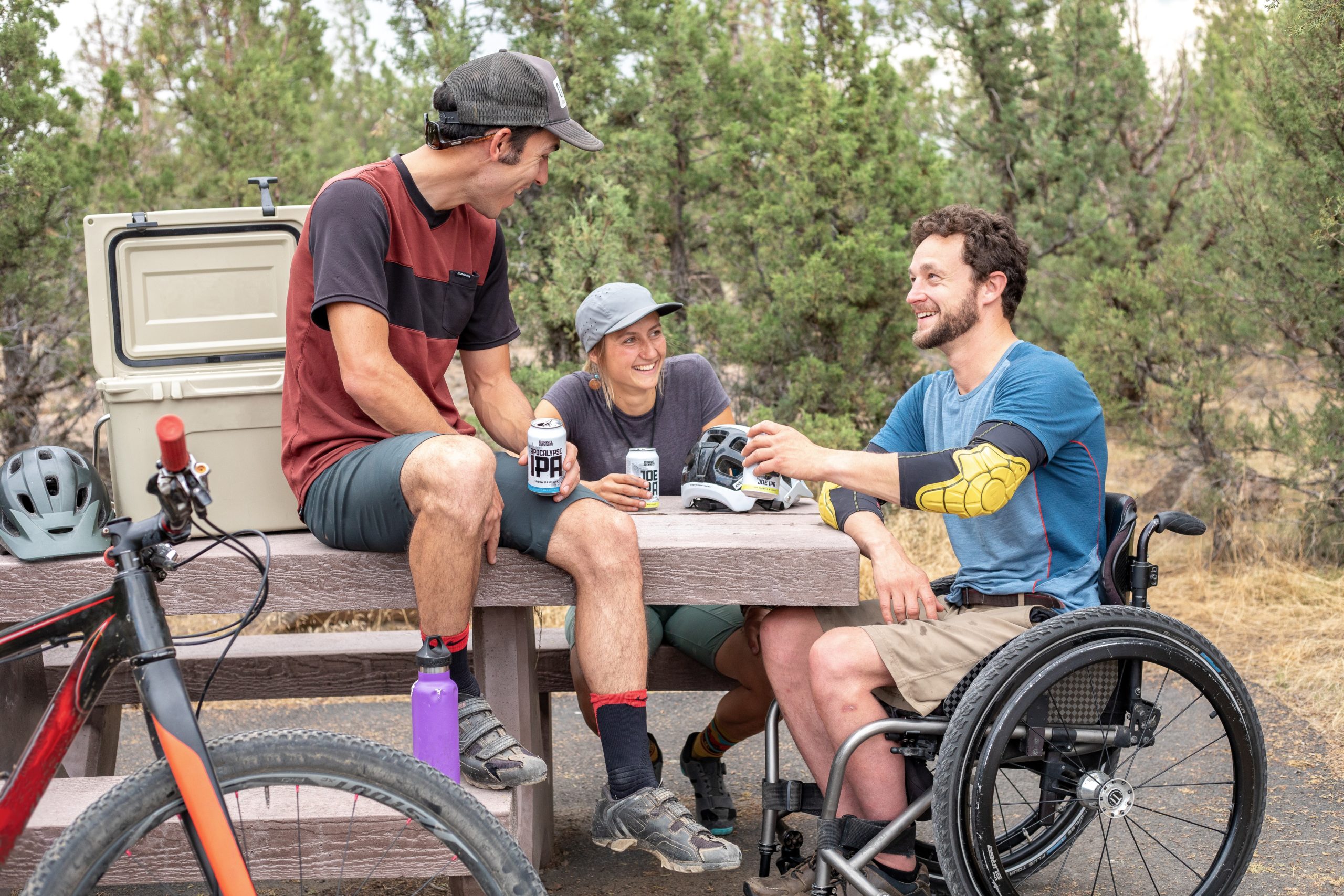 image of friends chatting with one in a wheelchair | wheelchair accessible porta potty oregon washington
