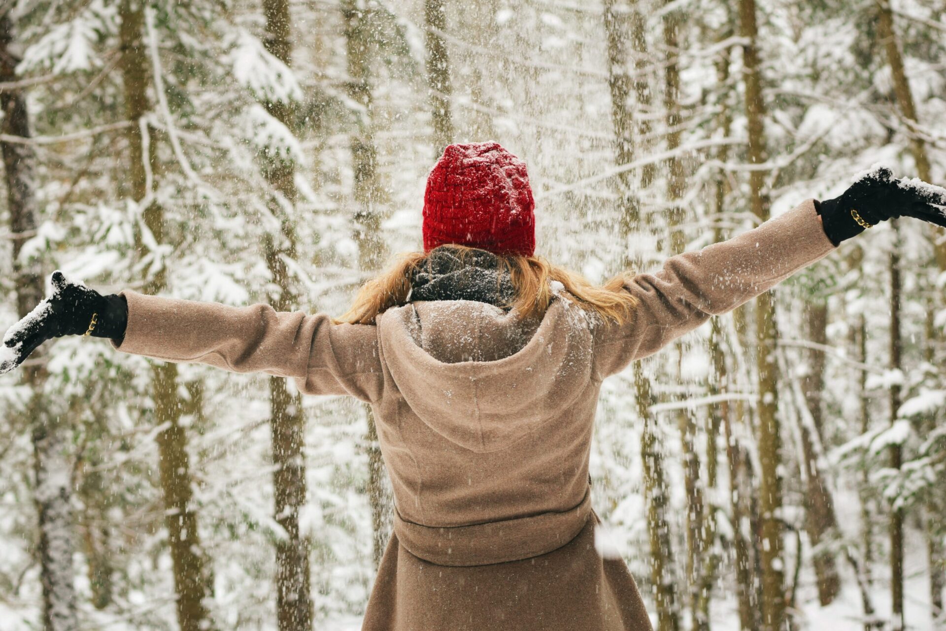 image of woman standing in snow with arms wide | portland vancouver salem oregon road races marathon portable toilet rental
