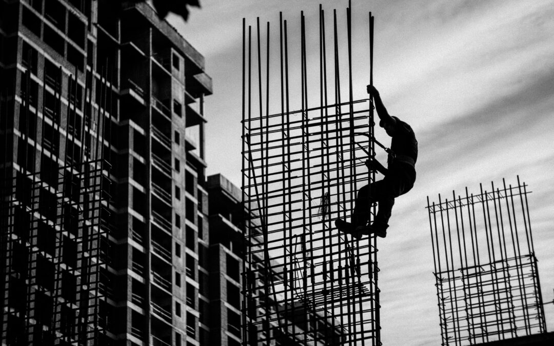 image of a construction worker on building in black and white | portland oregon porta potty rental washington construction sites