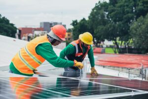 construction workers installing solar panels oregon washington 