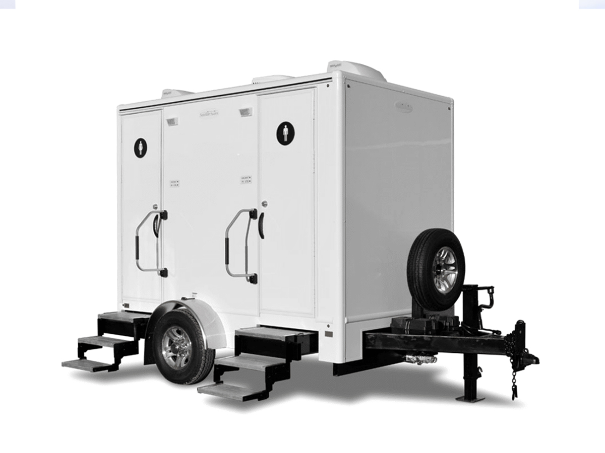 2-stall luxury restroom trailer on a white backdrop.